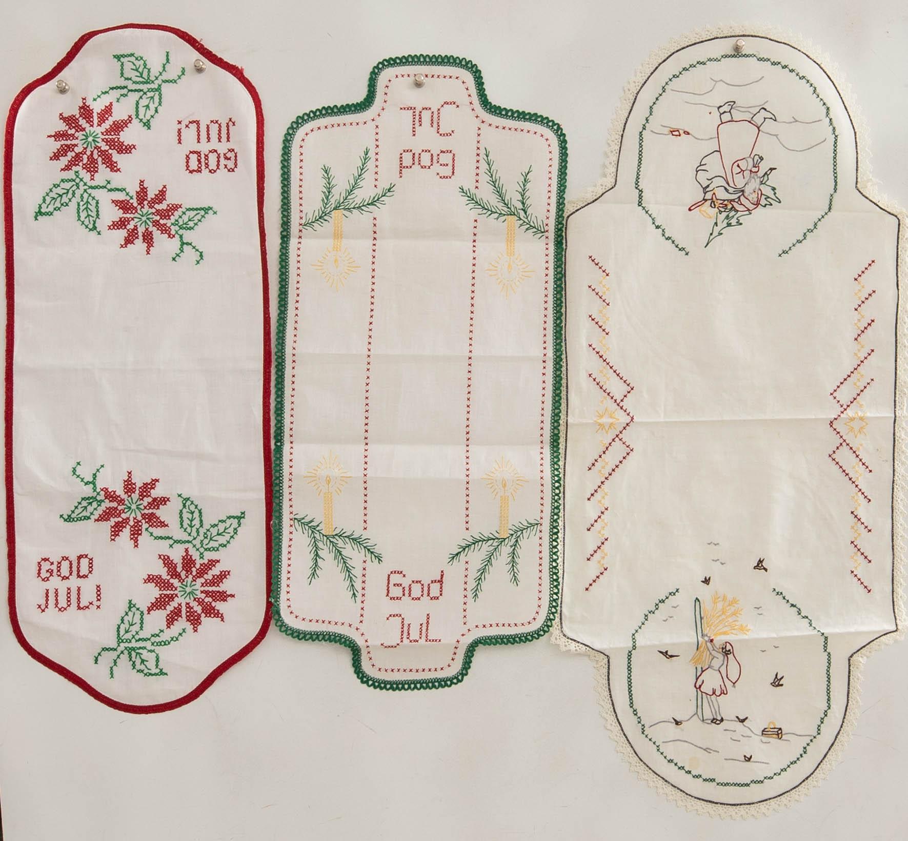 A collection of smaller Christmas tablecloths, runners, and wall hangings, approximately 34 pieces, mid/second half of the 20th century.
