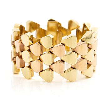 560. A bracelet 14K gold in two colours.
