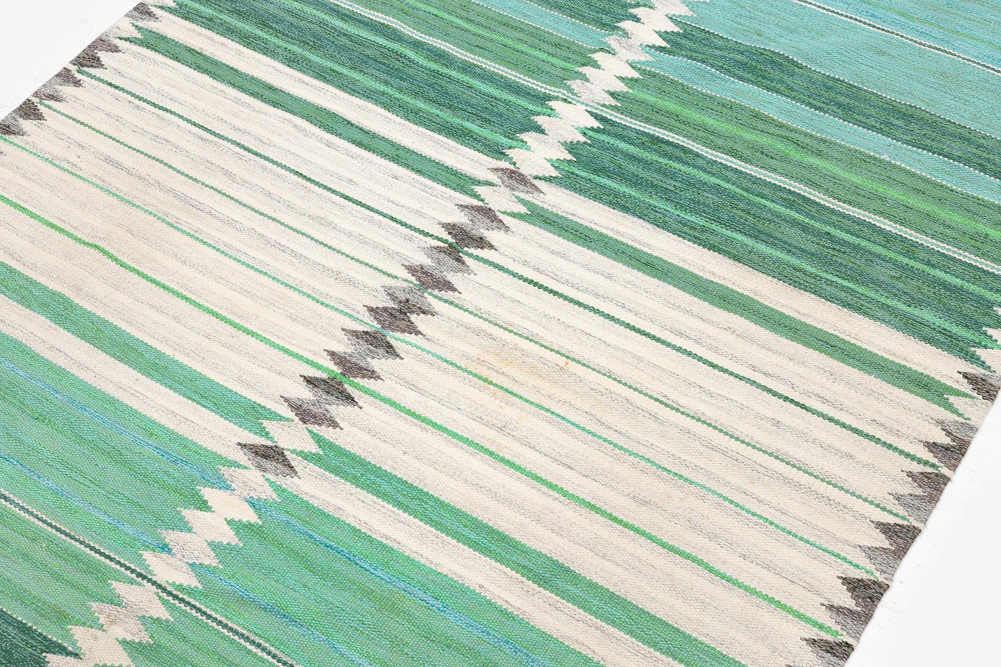 Marianne Richter, a "Rosita, grön" carpet, flat weave, c. 260 x 173 cm, signed AB MMF V MR.