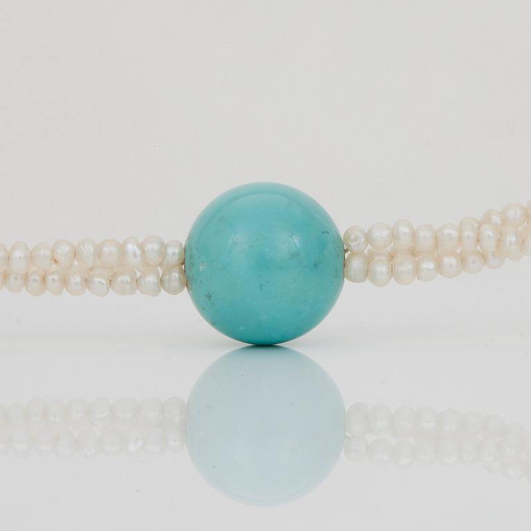 A seed pearl and turquoise bead necklace.