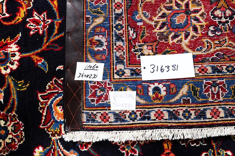 A carpet, Kashan signed Najafi, ca 360 x 231 cm.