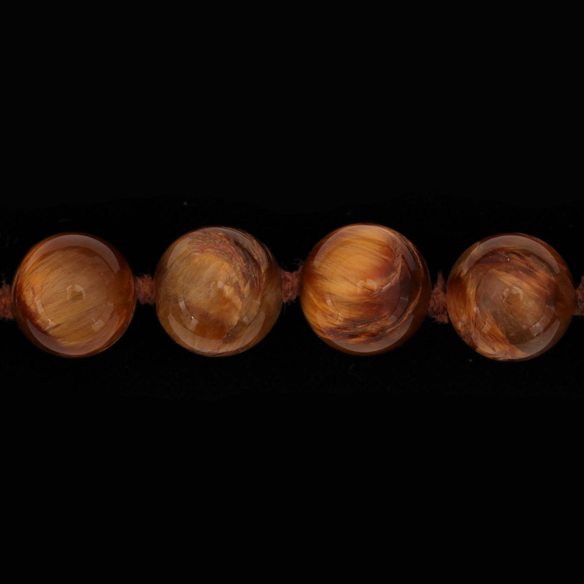 A Tiffany & Co Angela Cummings necklace with tigers eye quartz and gold clasp.