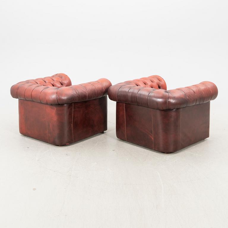 A pair of Chesterfield leather armchairs later part of the 20th century.