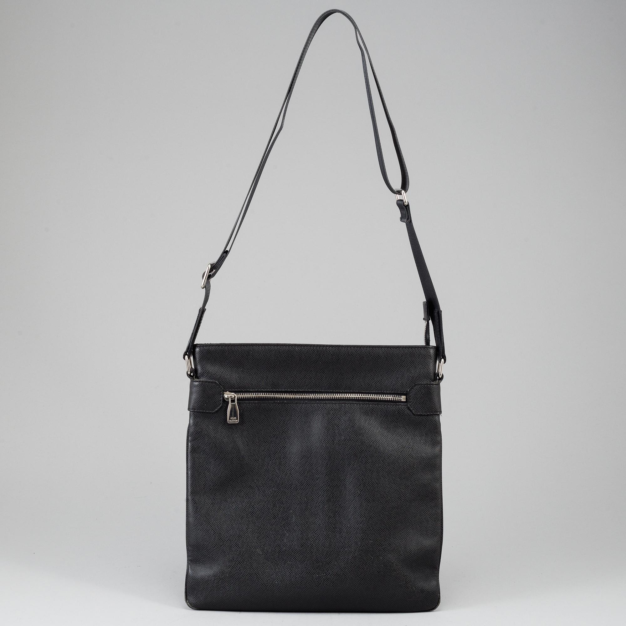 LOUIS VUITTON, a black Taiga bag, 2012.
