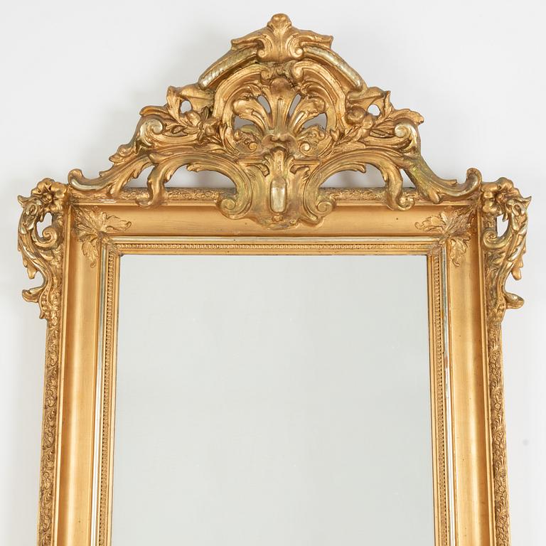 A rococo-style mirror and console table, around 1900.
