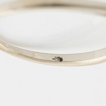 A 14K gold ring set with a round brilliant-cut diamond.