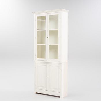 A painted book cabinet, 21st century.