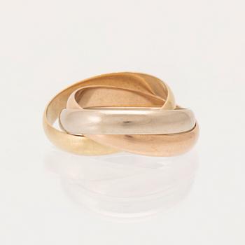 An 18K tri-coloured "Trinity" gold ring by Cartier.