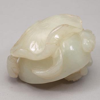 A pale celadon nephrite carving of a lotus pod, Qing dynasty (1644-1912).