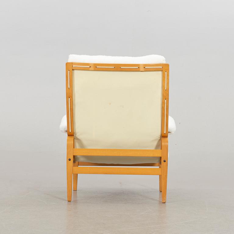 BRUNO MATHSSON, an "ingrid" armchair and stool for Dux. Late 20th century.