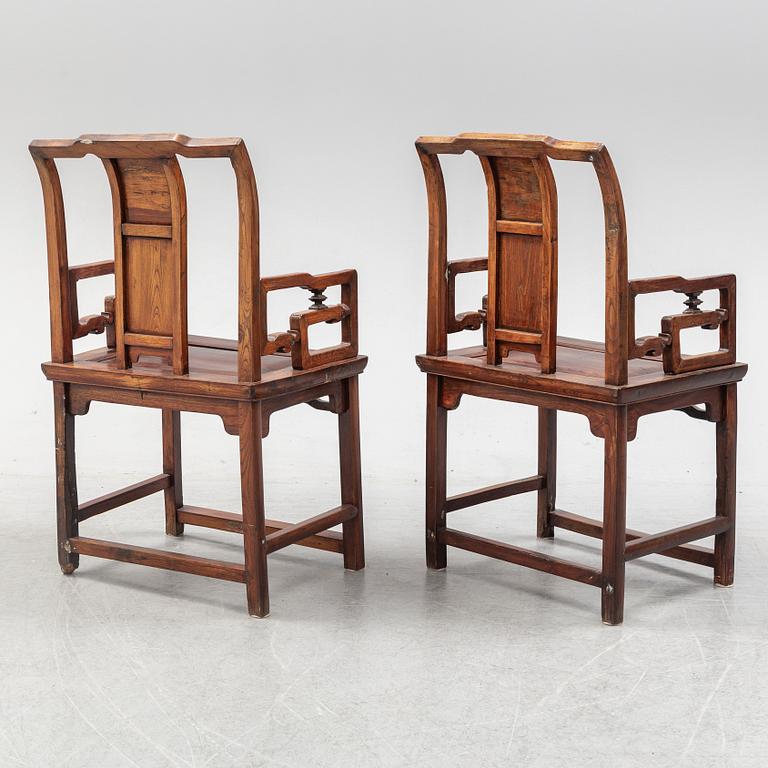 A pair of Chinese hardwood armchairs, early 20th century.