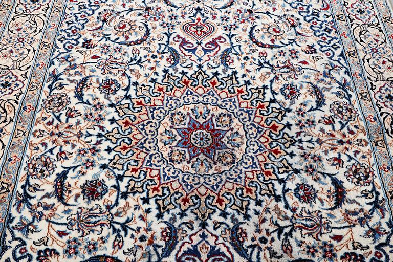 A Nain carpet, part silk, 9 laa, c. 293 x 199 cm.