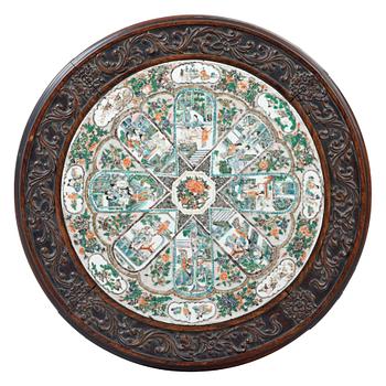 A hardwood and porcelain plaquette in famille verte  table, Qing dynasty 19th century.