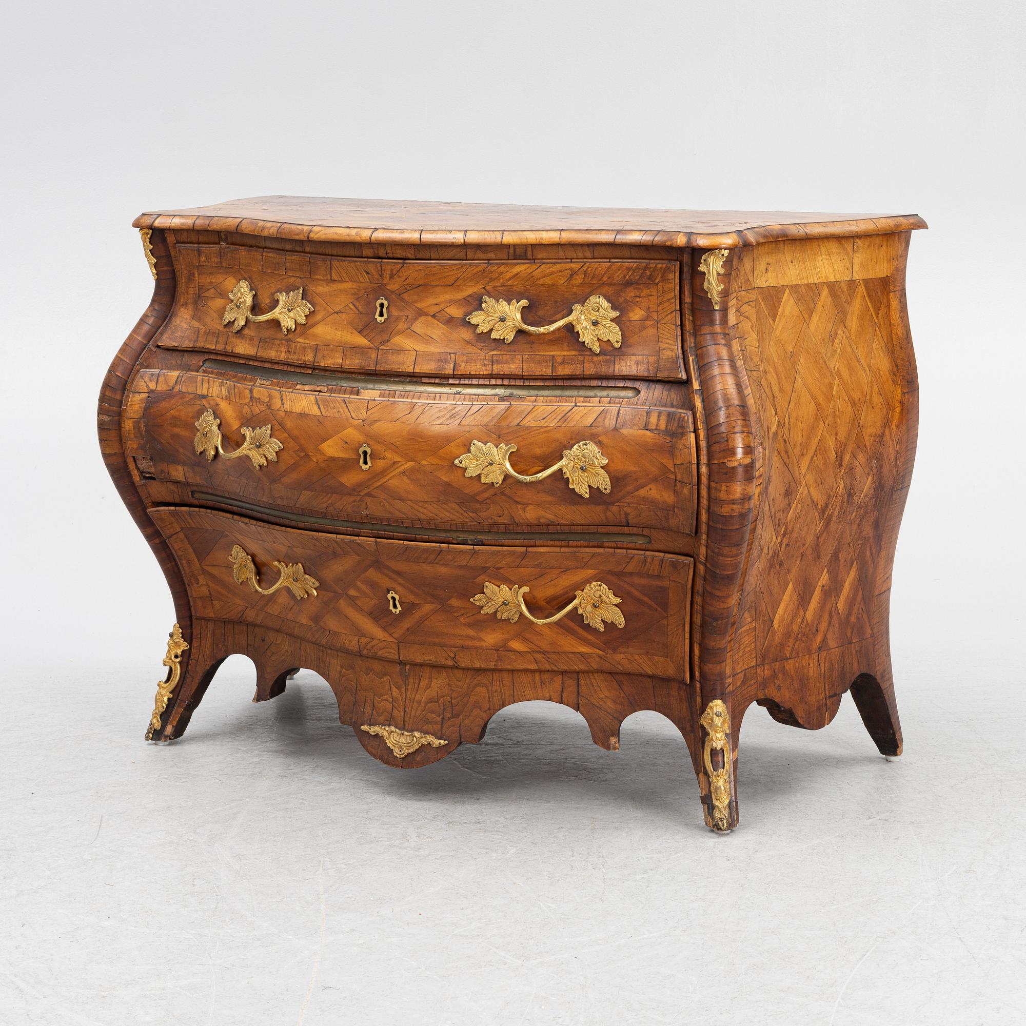 A Swedish rococo parquetry commode, Stockholm, later part of the 18th century.