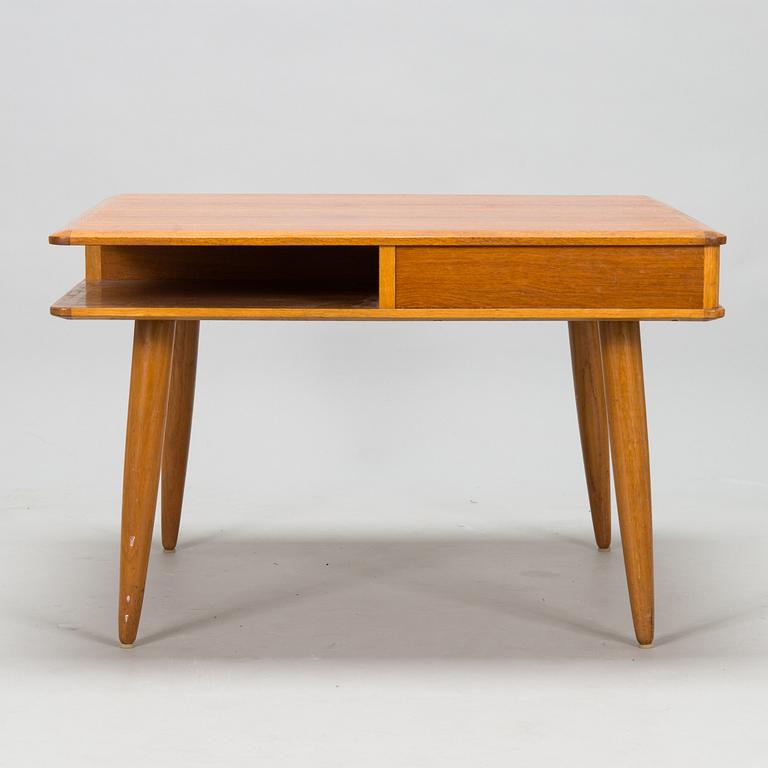 A 1950s/60s coffee table with drawers.