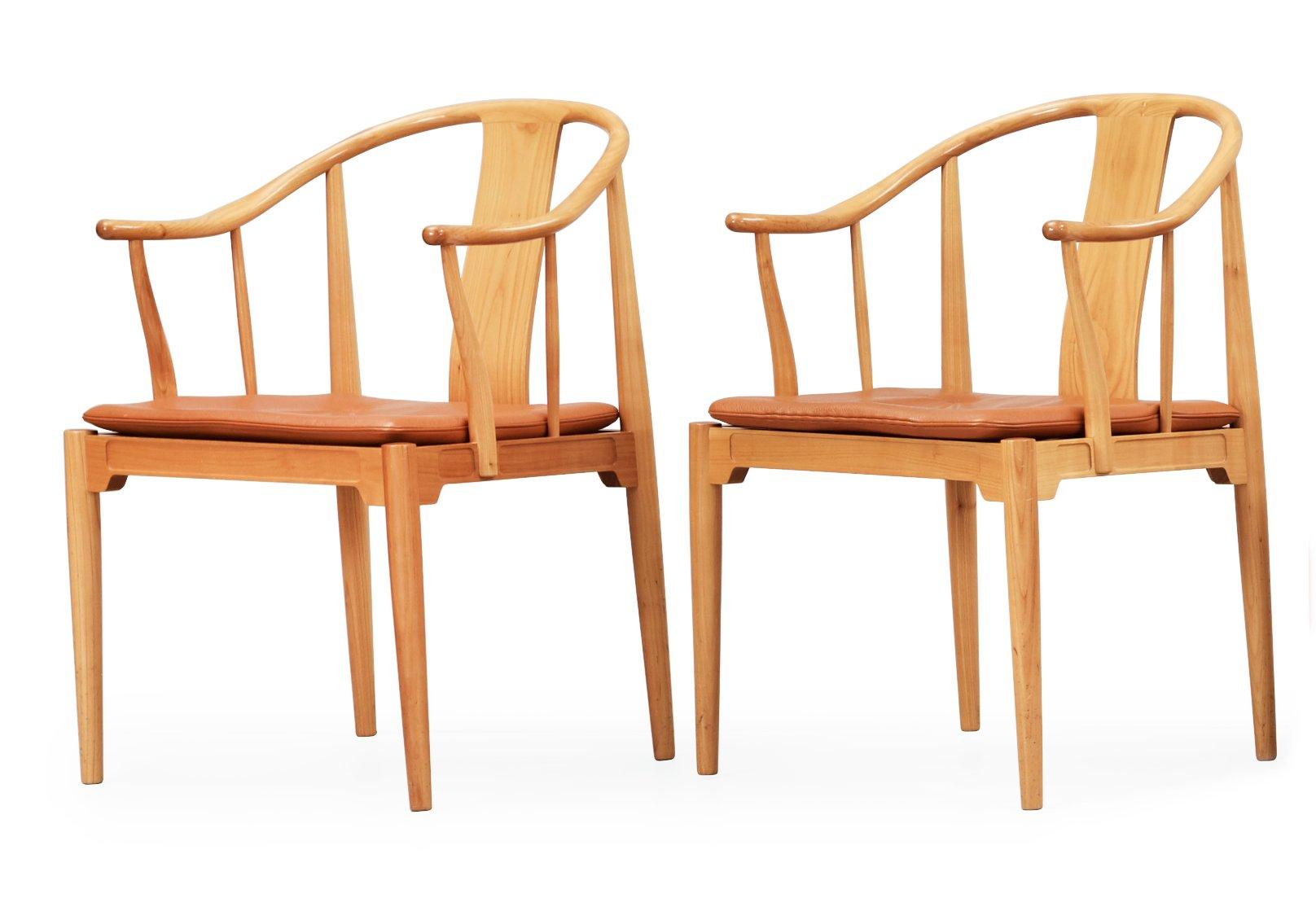 A pair of Hans J Wegner cherry and brown leather 'China chairs', Fritz Hansen, Denmark 1988.