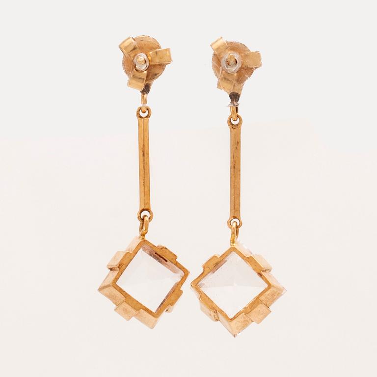 A set of 18K gold earrings and ring with faceted rock quartz crystal.