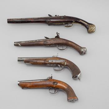 Four percussion and flintlock revolvers from the late 18th century / 19th century.