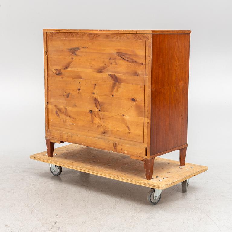 A chest of drawers, circa 1900.