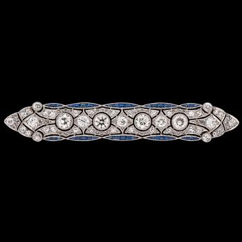 1132. An old cut diamond and blue sapphire brooch, c. 1915.