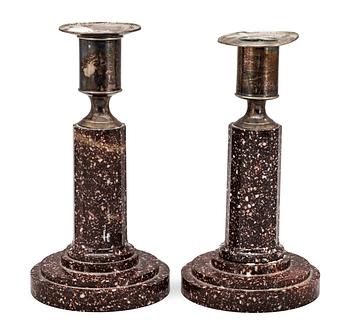 630. A pair of late Gustavian early 19th Century porphyry and silver candlesticks.