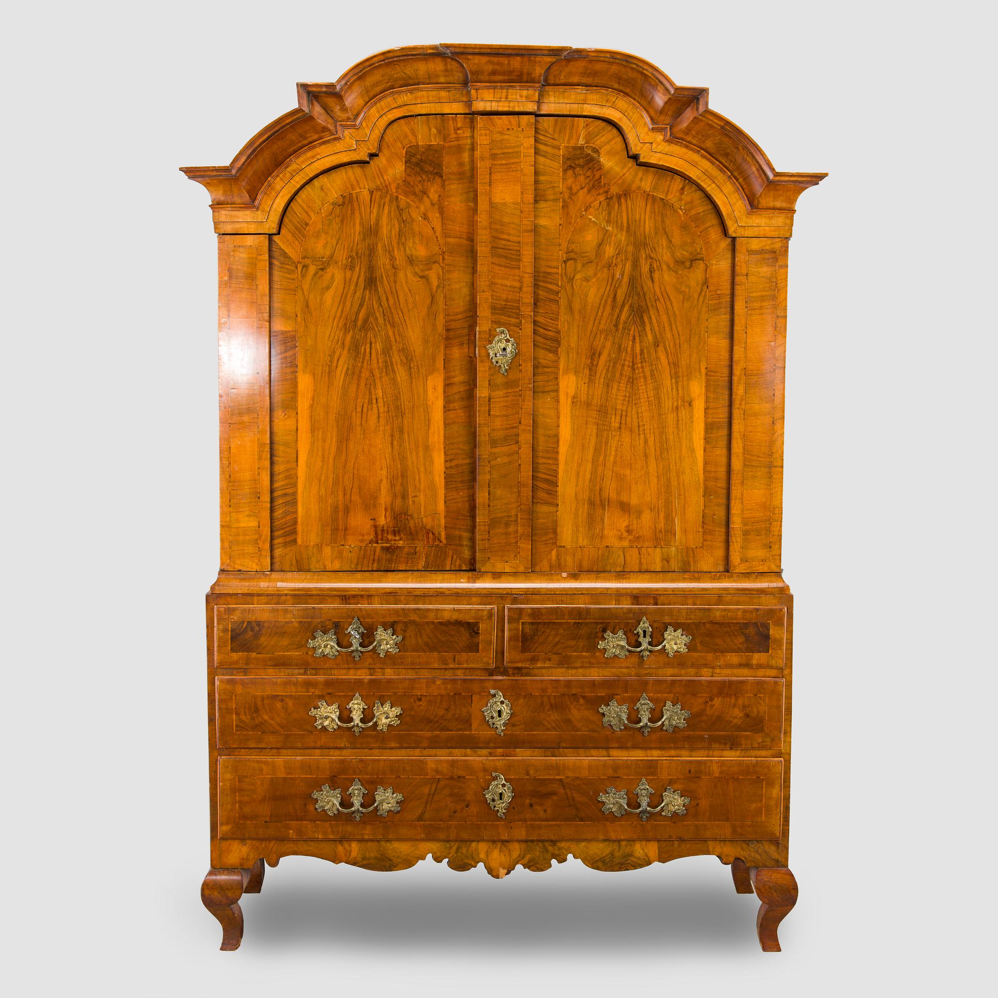 A Swedish walnut-veneered rococo cabinet in the manner of C. Linning, latter half of the 18th Century.