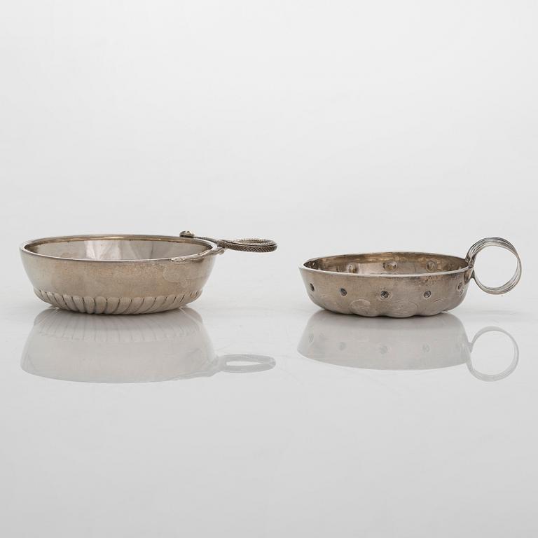 Two French silver taste du vin cups, 1819-38 and early 20th century.