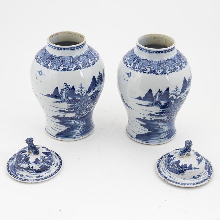 A pair of blue and white Chinese porcelain jars with covers. Qing dynasty, Qianlong (1736-95).