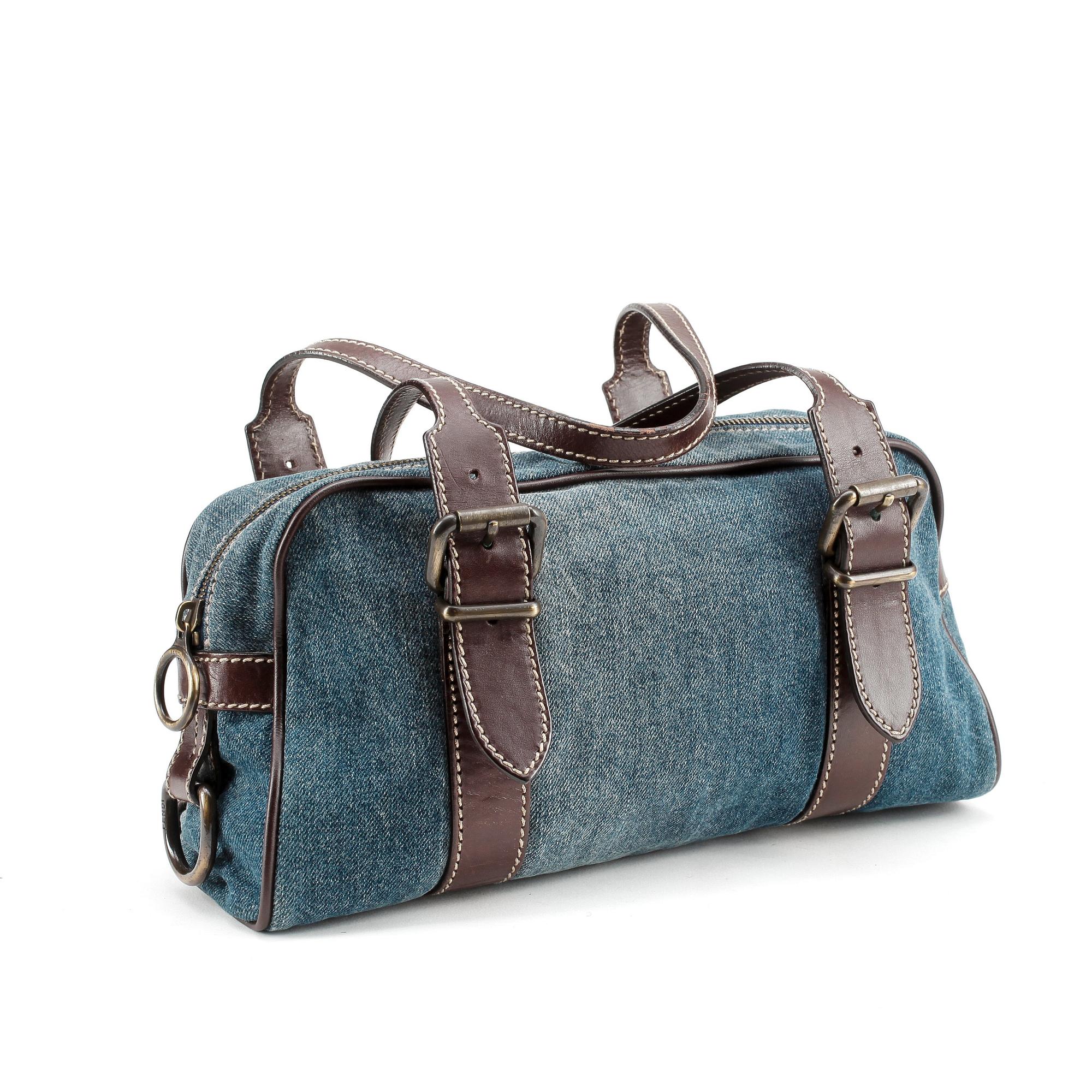 FENDI, a denim and brown leather shoulder bag.