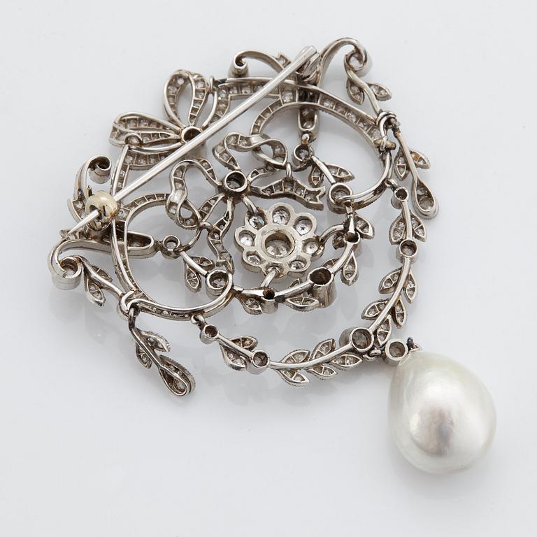 A platinum brooch set with old-cut diamonds and with a drop shaped pearl.