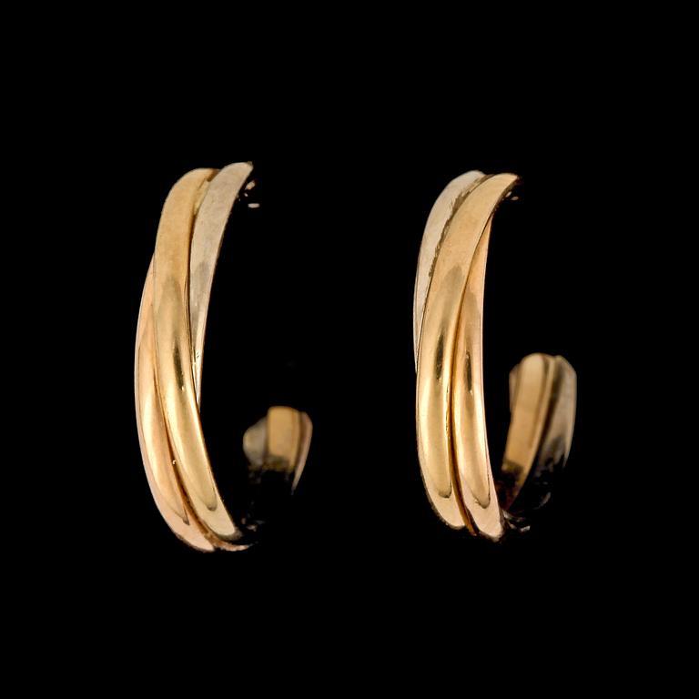 A pair of Cartier Trinity earrings.