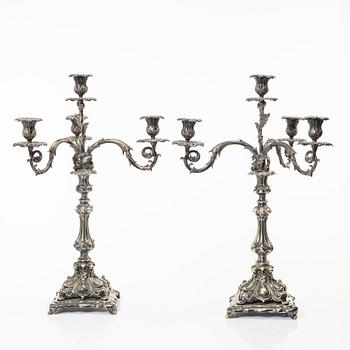 A pair of silver plated Rococo style candelabra, 20th century.