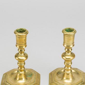 A pair of brass candle stick, 18/19th century.