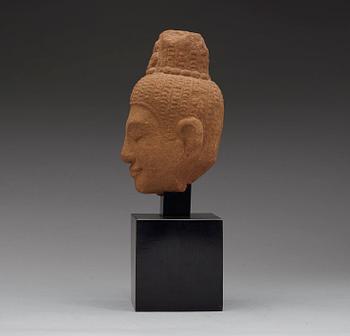 A sand stone figure of a Buddhas head, Thailand presumably 12th century.