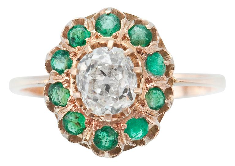 A RING, old cut diamond c. 0.70 ct and emeralds.