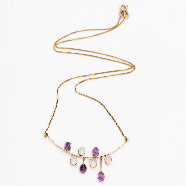 Kaulakoru, 14K kultaa, cabochonhiottu kuukvartsi ja ametisti. Suomalaiset leimat.