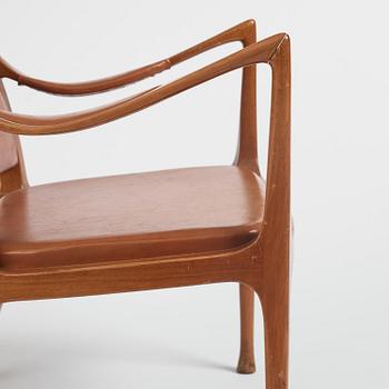 Hans Asplund, a walnut and leather easy chair, Nordiska Kompaniet, ca 1955, for the Nordiska Kompaniet beauty salon.