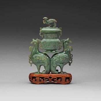 136. A moss green jade double fenix figurine, 20th century.