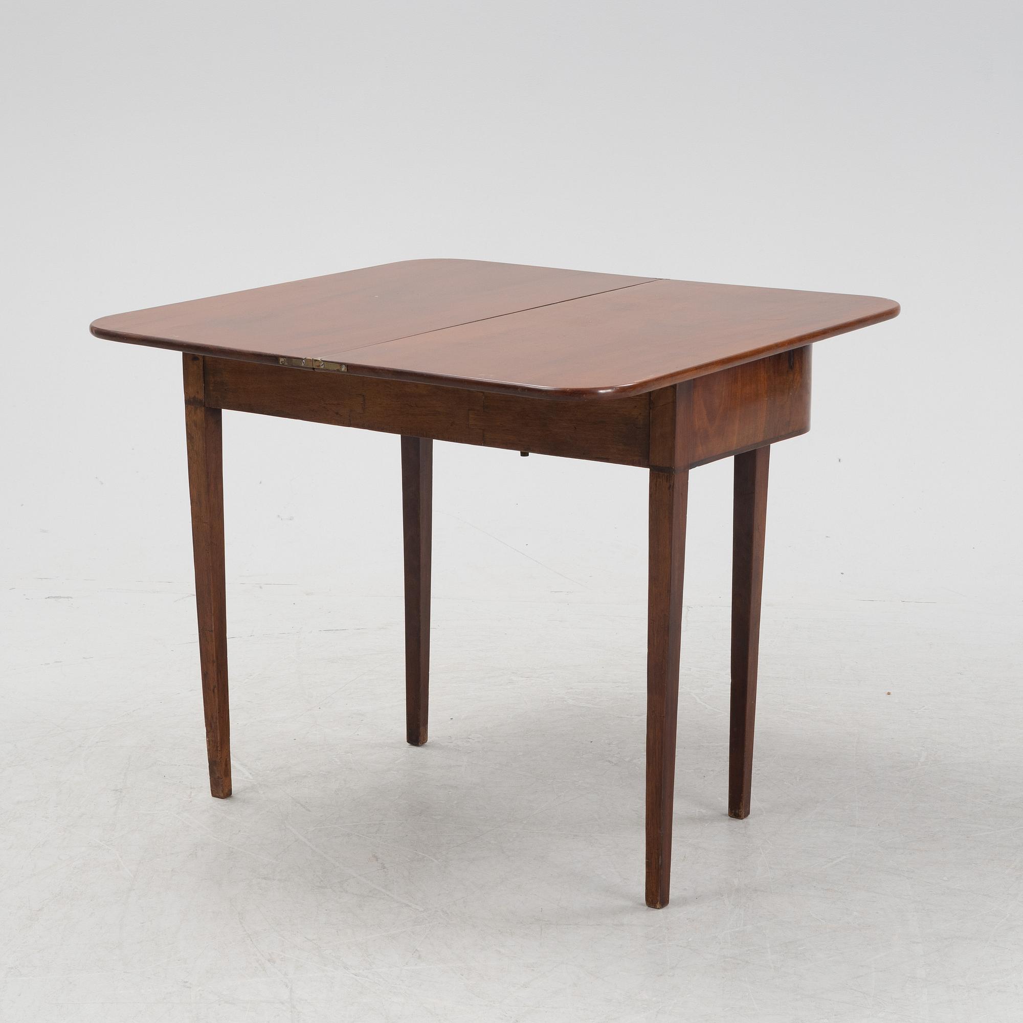 A mahognay card table, early 19th Century.