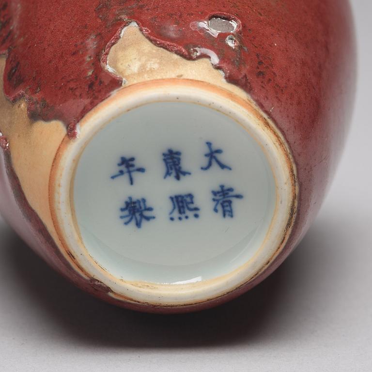 A sang de boef vase and bowl and an enamelled cup with cover and stand, Qing dynasty (1664-1912).