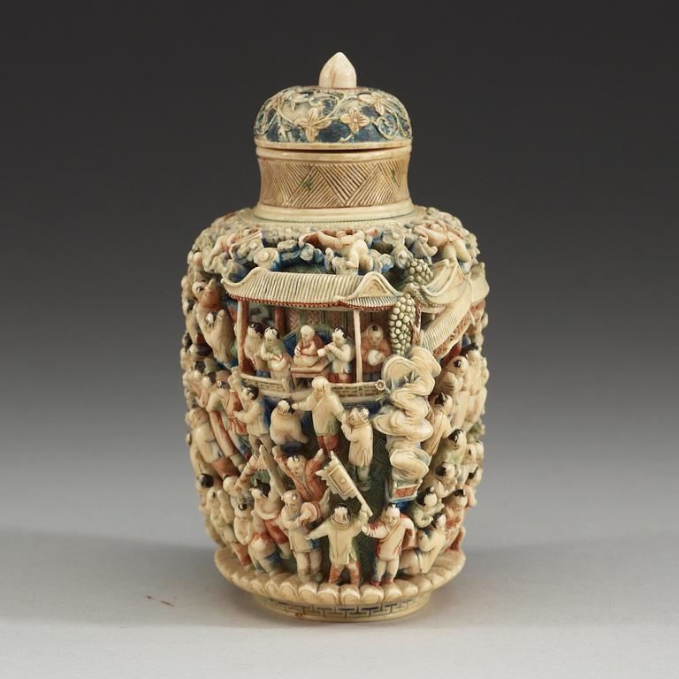 A deeply carved ivory snuff bottle with cover, China, early 20th Century.