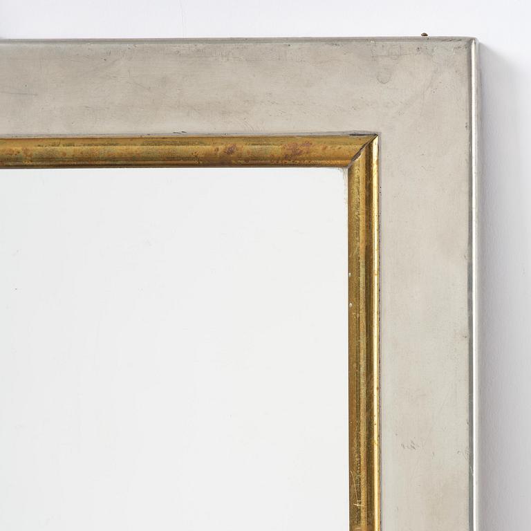 Firma Svenskt Tenn, a pewter and brass wall mirror model 2283, Firma Svenskt Tenn, Stockholm, 1952.
