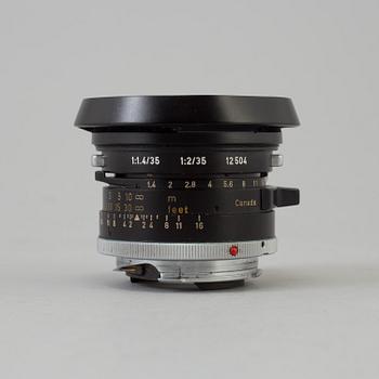 A black Leica Summilux 1:1.4 /35 Leitz  Lens no 2391303, Canada.