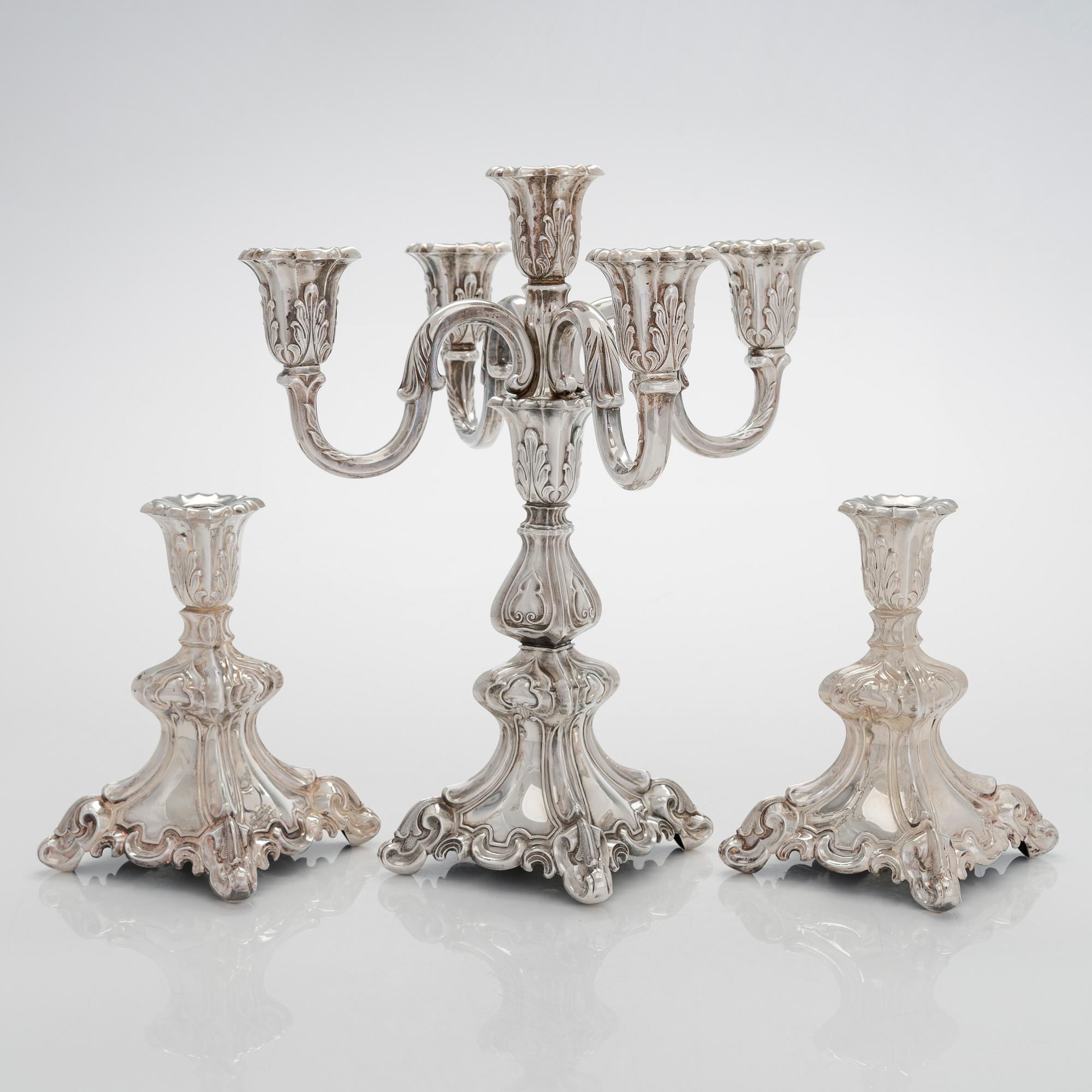 A 5-candle silver candelabra and a pair of candlesticks, silver, Auran Kultaseppä, Turku 1984.