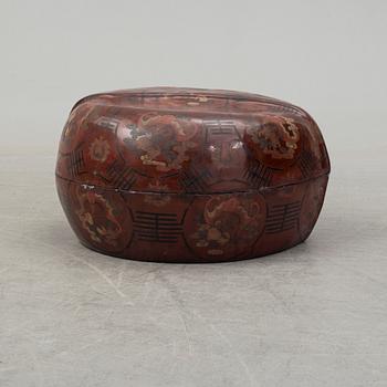 A massive Japanese wooden and lacquered box with cover, in the shape of a peach, early 20th century.