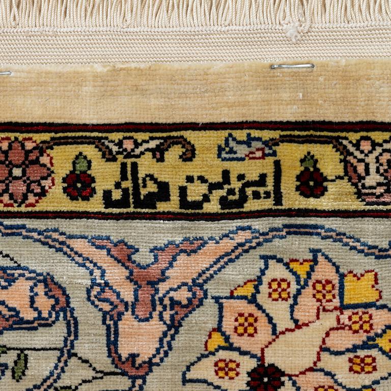 A silk Hereke rug, Turkey, approx. 82 x 58 cm.