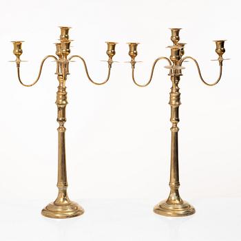 A pair of brass candelabra, model N12, Nyköpings Bruk, Sweden, around 1900.