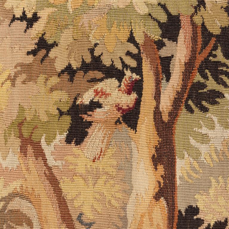 A European 'verdur' tapestry, c. 297 x 290 cm, 17th century.