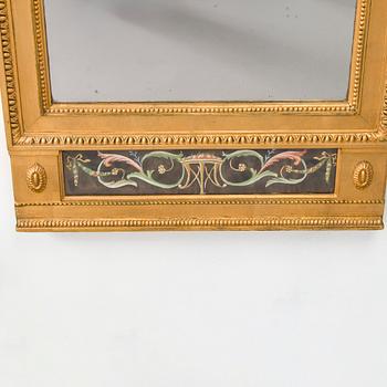 An Empire mirror, first half of the 19th century.