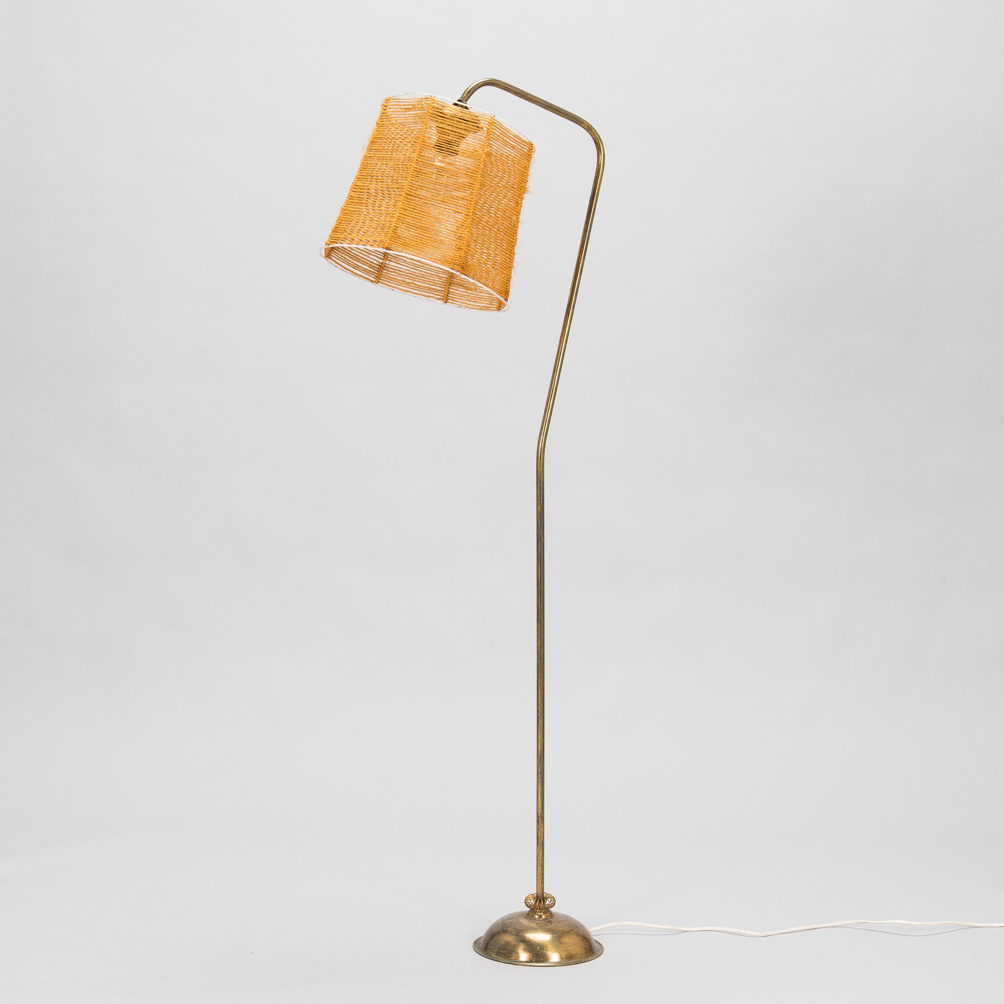 A 1950s floor lamp in brass.